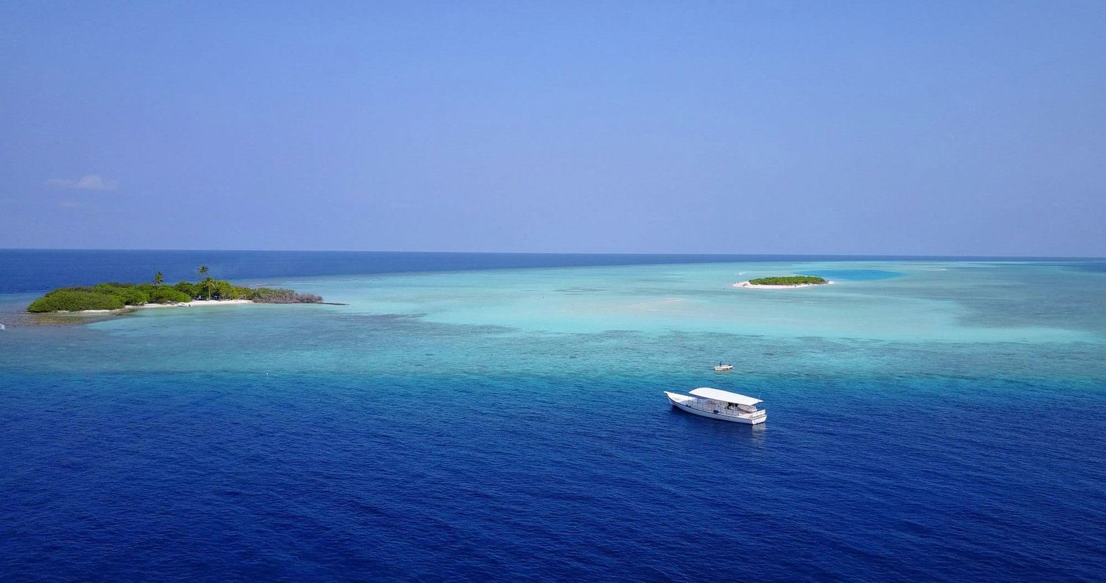 Aerial view of a boat near an island in the Maldives