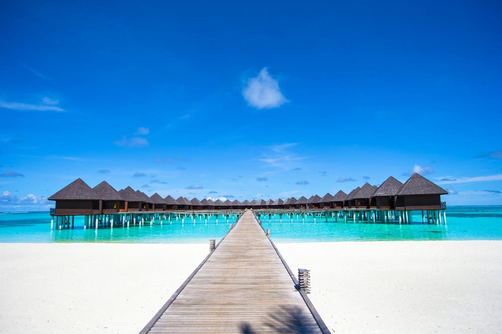 Water bungalows and wooden jetty on Maldives